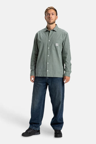 T-shirt vert avec longues manches de DC SHOES, avec un motif rayé et une poche poitrine.