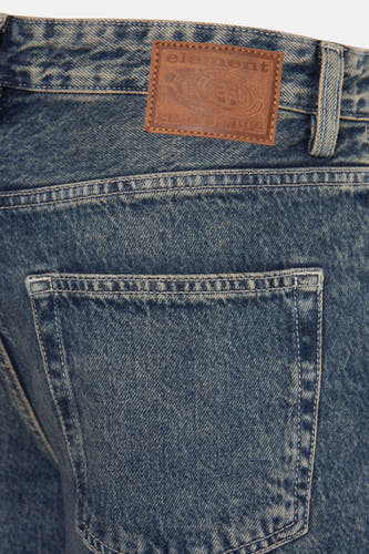 Jean large d'ELEMENT en denim bleu, avec poche arrière et étiquette de marque sur la ceinture.