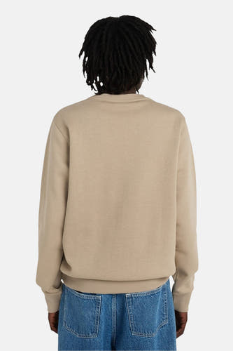 Beige sweater van ELEMENT, rugaanzicht met dreadlocks en blauwe jeans.
