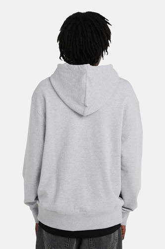 Grijze sweater met kap van ELEMENT, gezien van achteren met dreadlocks en een donkere broek.