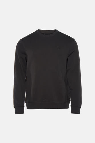 Pull noir ELEMENT, à manches longues, combiné avec un jean déchiré et des baskets beiges.
