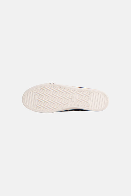 Baskets noires de TOMMY JEANS, avec semelle blanche à motif chevrons.