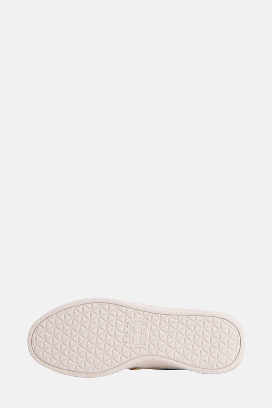 Sneakers beige de TOMMY JEANS, avec un motif géométrique sur la semelle.