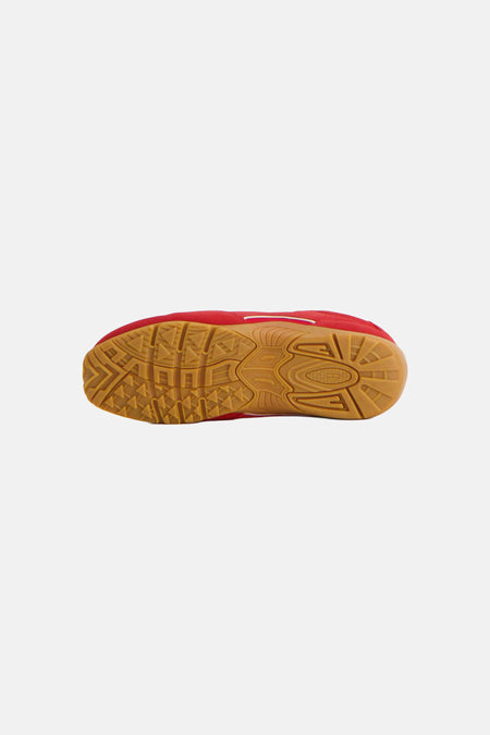 Baskets rouges de TOMMY JEANS, avec une semelle marron à profil géométrique.