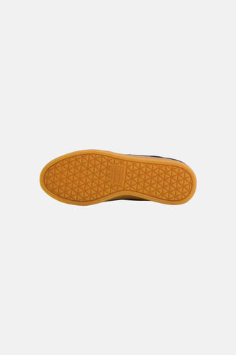 Blauwe sneakers van TOMMY JEANS met oranje rubberzool en geometrisch profiel, onderaanzicht