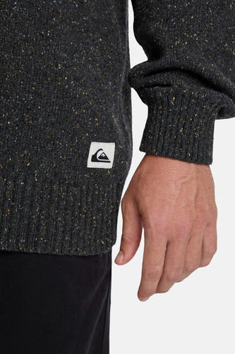 Sweat-shirt gris avec col rond de Quiksilver, avec un détail de texture tachetée et un patch logo sur la couture latérale.