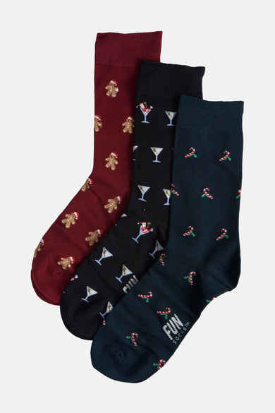 Chaussettes multicolores de FunSocks, avec des motifs de Noël comme des hommes gingerbread, des cocktails et des bouteilles de soda.