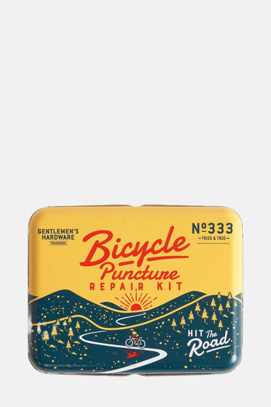 Kit de réparation de vélo multicolore de Gentlemen's Hardware avec des illustrations d'une route sinueuse et de sapins.
