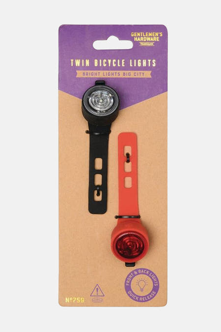 Ensemble d'éclairage de vélo multicolore de Gentlemen's Hardware, avec des ampoules noires et rouges sur un emballage en carton.