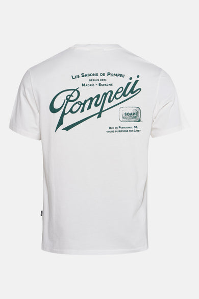 T-shirt écru à manches courtes de POMPEII, avec imprimé vert "Les Sabons de Pompeii" au dos.