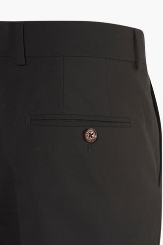 Pantalon de costume noir Le Le Fabux Marcel de Brux,, détail de bouton sur la poche arrière.