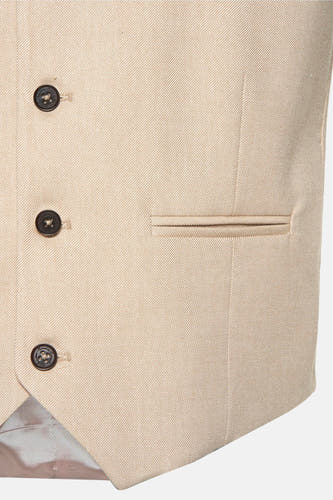 Gilet beige de Le Fabuleux Marcel de Bruxelles, avec fermeture à boutons et poche.