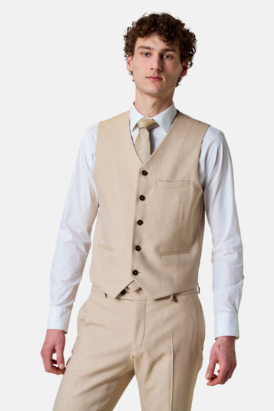 Gilet beige de Le Fabuleux Marcel de Bruxelles, avec une cele réglable et une subtile texture.