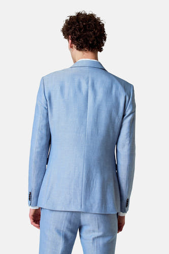 Blazer bleu de Le Fabuleux Marcel de Bruxelles, vu de l'arrière, avec des boutons sur les manches.