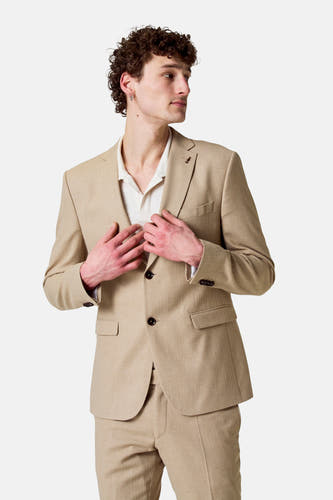 Blazer beige de Le Fabuleux Marcel de Bruxelles, avec fermeture à boutons et motif structuré.