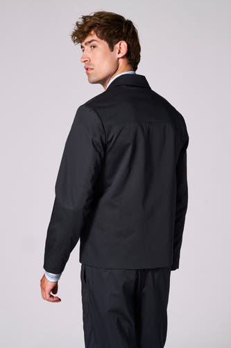Blazer bleu de Le Fabuleux Marcel de Bruxelles, avec des manches longues et un col classique.