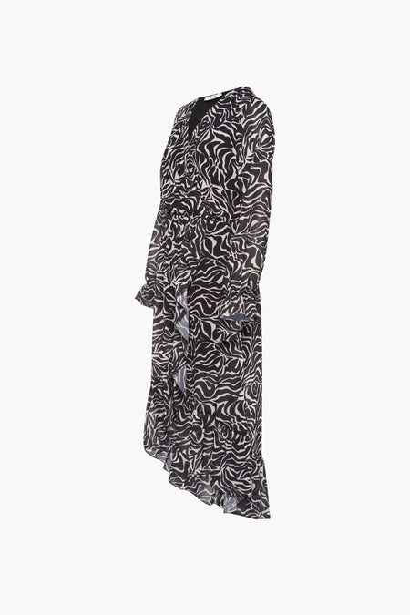 Robe noire à longues manches de HAILYS, avec un motif zébré noir et blanc frappant et des volants.
