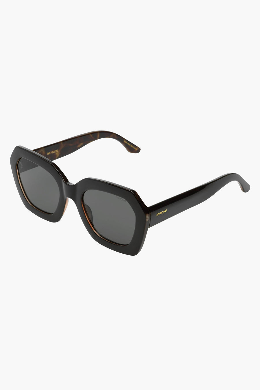 Lunettes de soleil noires KOMOMONO, avec un cadre tortue et une monture noire.