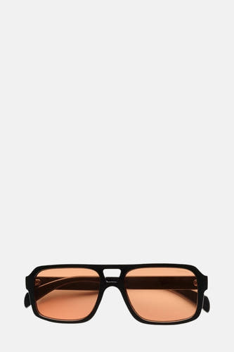 Lunettes de soleil noires KOMONO, avec des verres orange et un cadre rectangulaire.