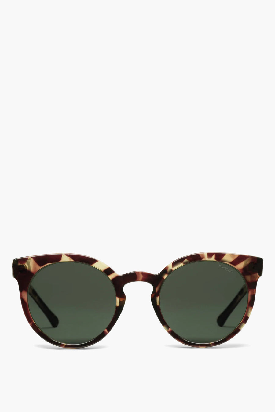 Lunettes de soleil jaunes de KOMONO, avec un cadre marron et beige tacheté.