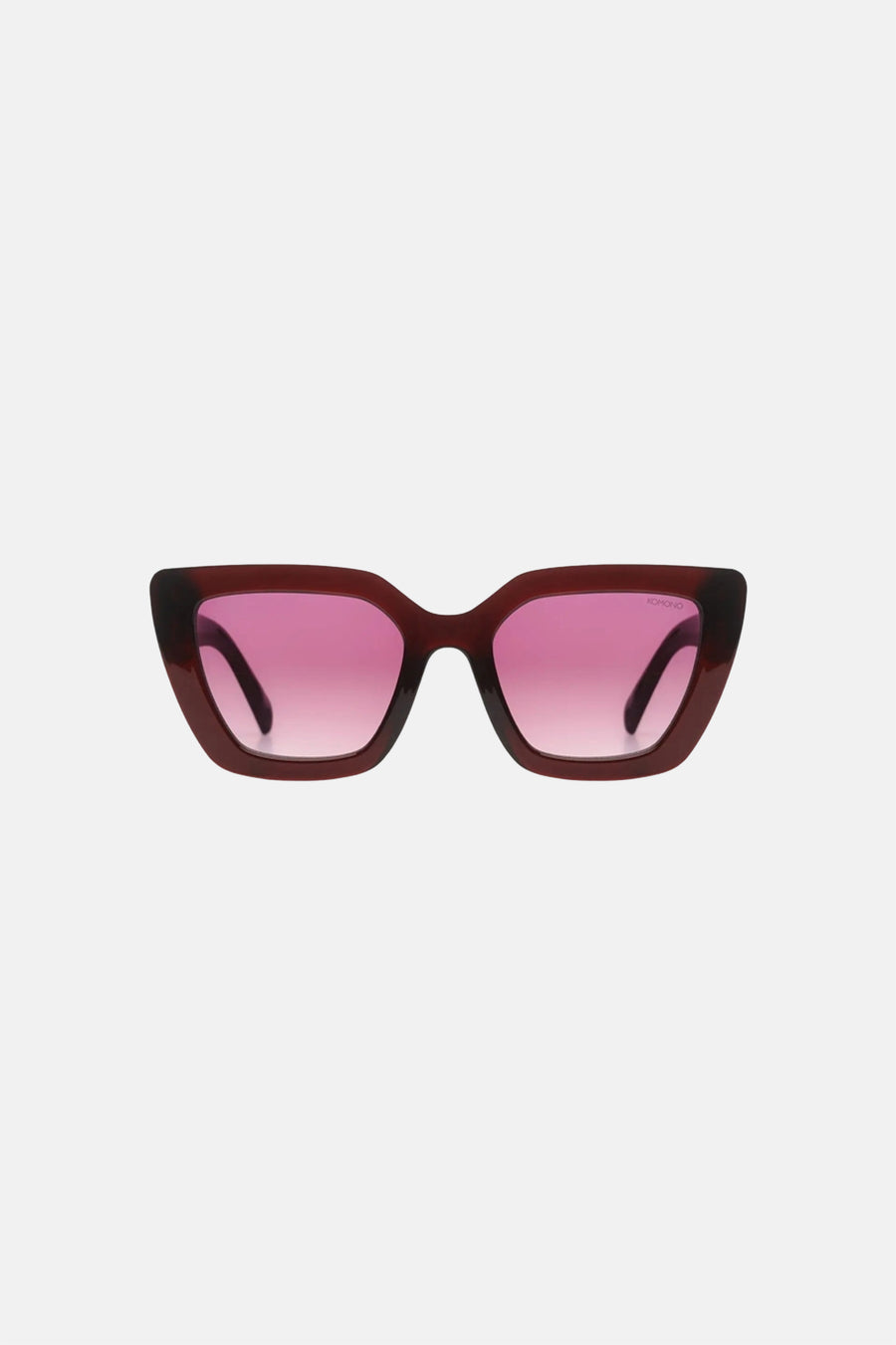 Lunettes de soleil œil de chat marron foncé de KOMONO avec verres dégradés roses.
