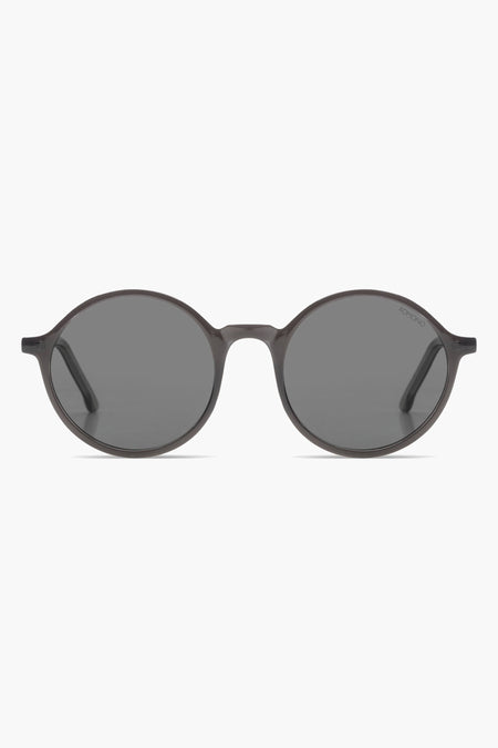 Lunettes de soleil grises de KOMONO avec un cadre élégant et des verres foncés.