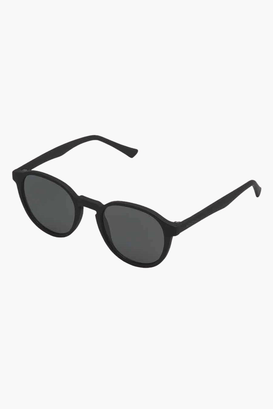 Lunettes de soleil noires KOMOMONO, avec un cadre rond et des verres foncés.