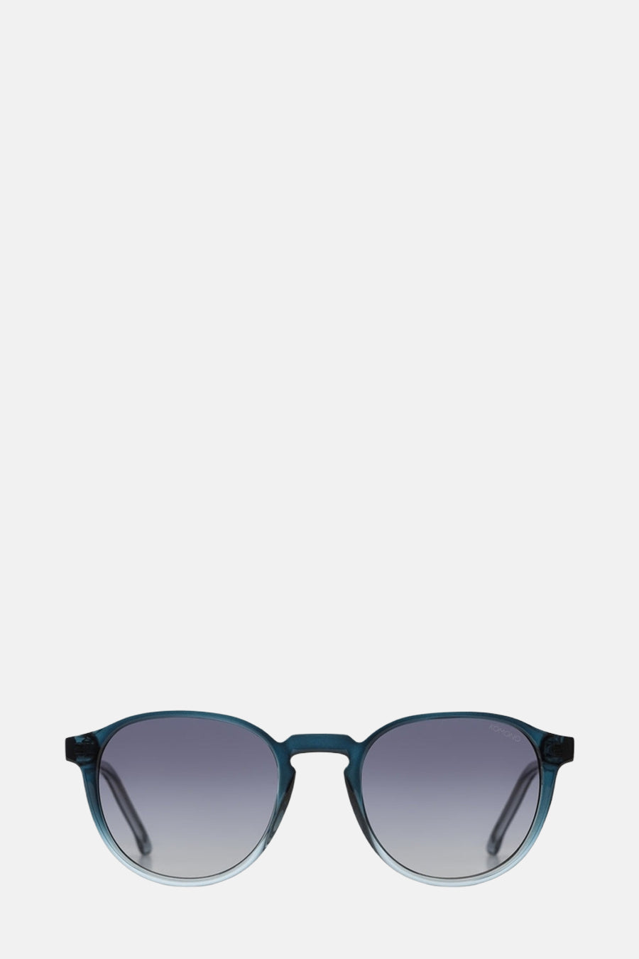 Lunettes de soleil bleues de KOMONO, avec une subtile transition de couleurs dans les verres et le montant.