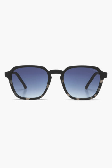 Lunettes de soleil noires KOMOMONO, avec des verres bleus et un cadre mêlé.