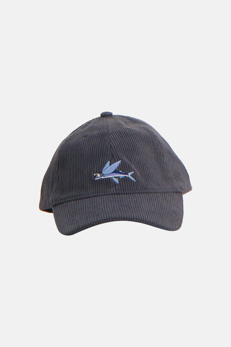 Casquette bleue LAKOR avec une texture velours côtelé, dos avec sangle réglable et étiquette.