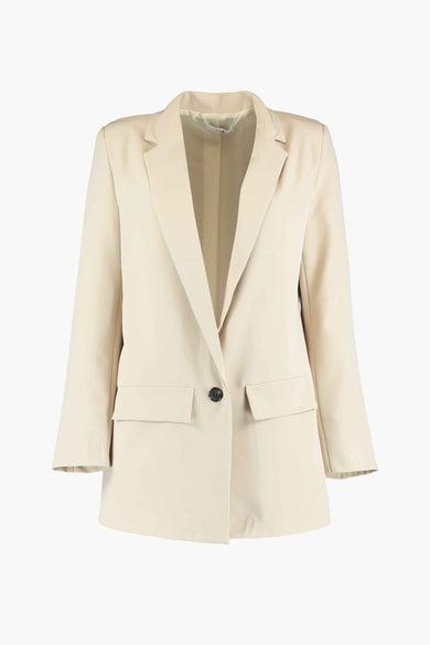Blazer beige de HAILYS à manches longues, col reversible et poches brodées, fermé par un bouton.
