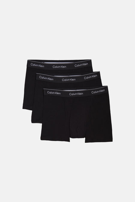 Boxer short noir Calvin Klein avec logo blanc sur la ceinture, photographié de dos.