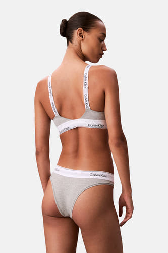 Soutien-gorge gris Calvin Klein, avec bretelles blanches à logo, vue de dos.
