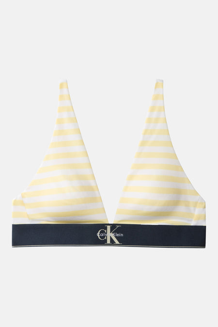 Soutien-gorge jaune à rayures de Calvin Klein avec des rayures blanches et une bande logo bleu foncé.