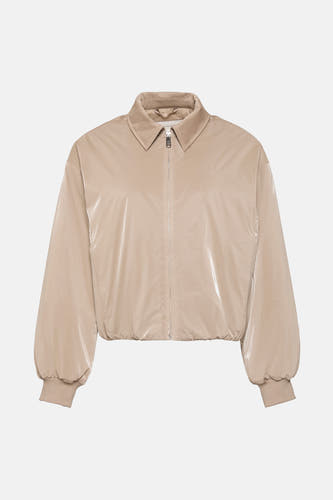 Veste beige de Calvin Klein, avec des manches ballon et un col.
