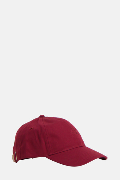 Bordeaux chien de Calvin Klein avec logo subtil sur l'avant et bandes réglables à l'arrière.