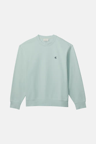 Gilet bleu de Calvin Klein Jeans, avec un petit logo CK sur la poitrine.