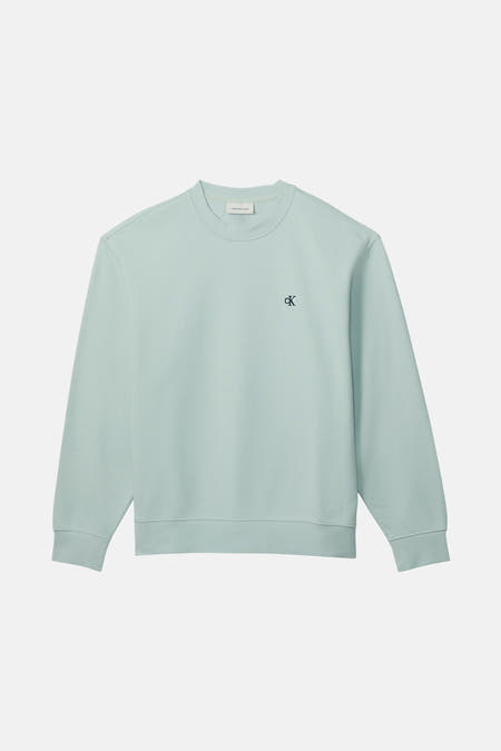 Gilet bleu de Calvin Klein Jeans, avec un petit logo CK sur la poitrine.