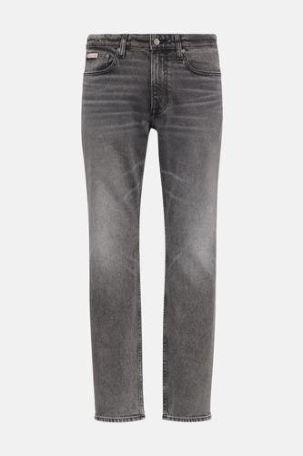 Jean slim fit gris Calvin Klein, avec une subtile usure et une texture denim classique.