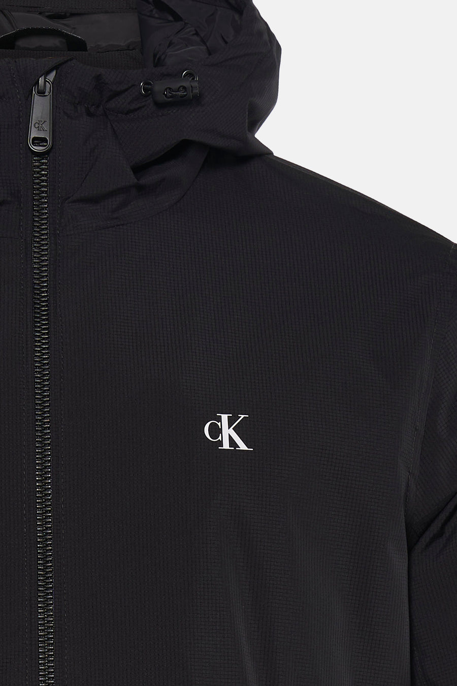 Manteau de pluie noir Calvin Klein, avec capuche et logo CK.