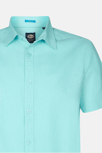 Chemise bleue marine à manches courtes de Petrol Industries, avec col et poche poitrine.