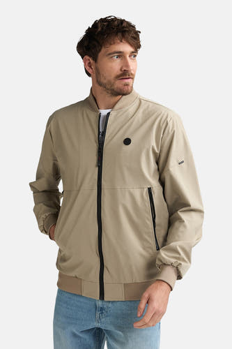 Manteau court beige de Petrol Industries®, avec fermeture éclair et badge rond de la marque sur la poitrine.