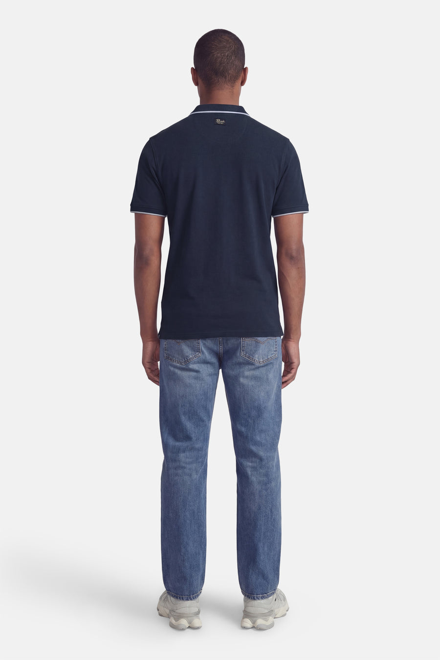 Polo bleue de Petrol Industries à manches courtes avec des accents blancs au col et aux manches.