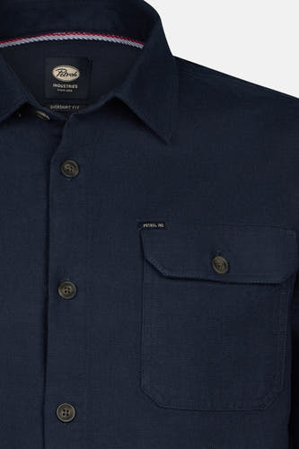Chemise bleue à manches longues de Petrol Industries, avec col boutonné et poches brodées.