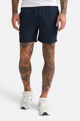 Short de bain bleu de Petrol Industries®, avec une poche arrière à détail orange.