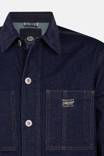 Veste en jeans bleu de Petrol Industries avec une poche poitron et un fermeture à boutons.