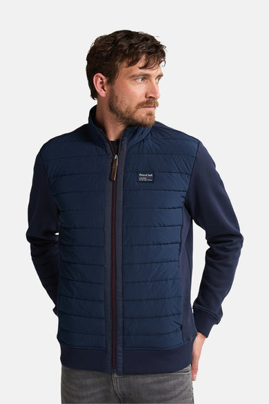 Short, blue jacket from Petrol Industries, with a sewn-on front and dark blue sleeves.