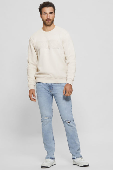 Pull col rond écru de Guess avec logo Guess Los Angeles en relief sur le devant.