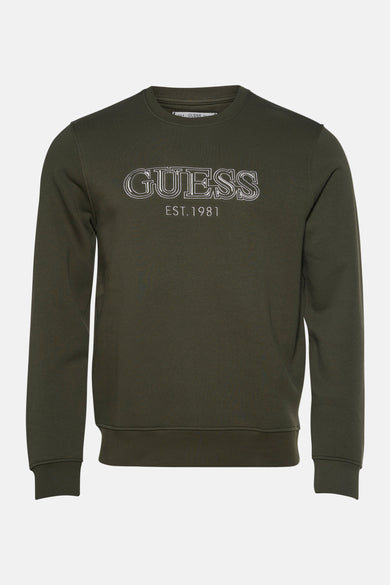 Sweater vert de Guess avec le texte "GUESS EST. 1981" en lignes blanches.