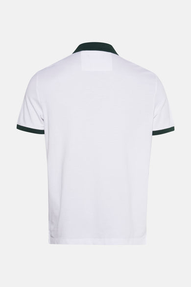 Wit poloshirt met groene details.